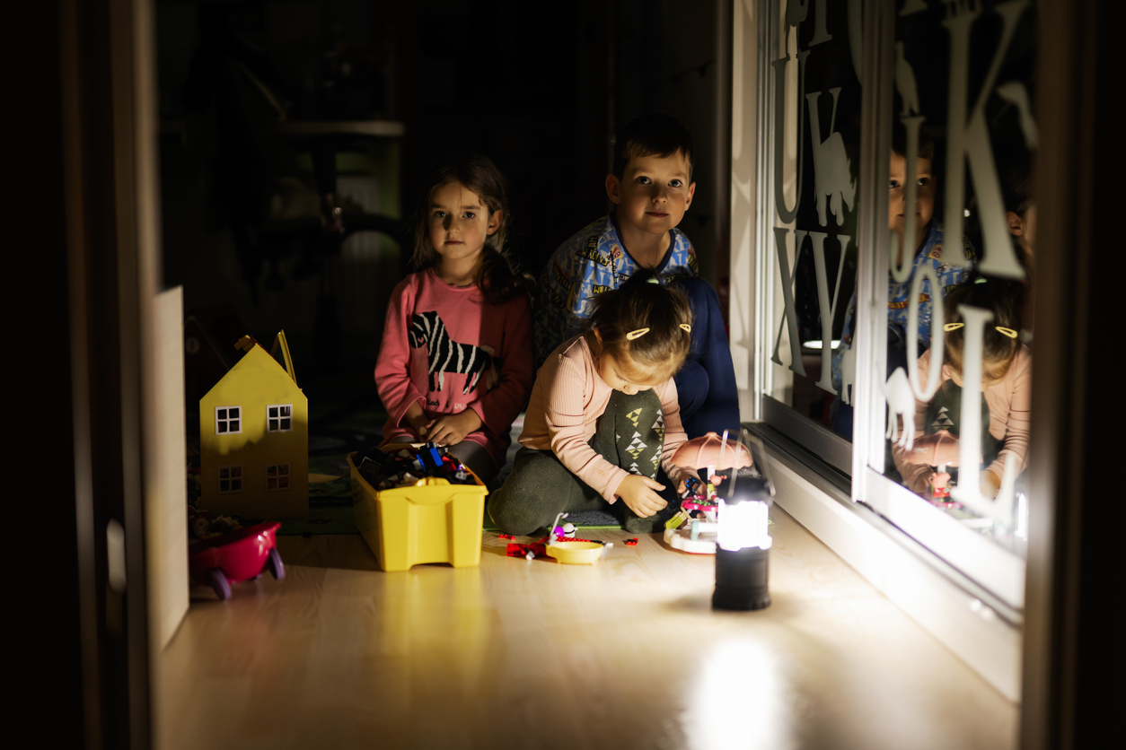 Children using flashlights during a power outage